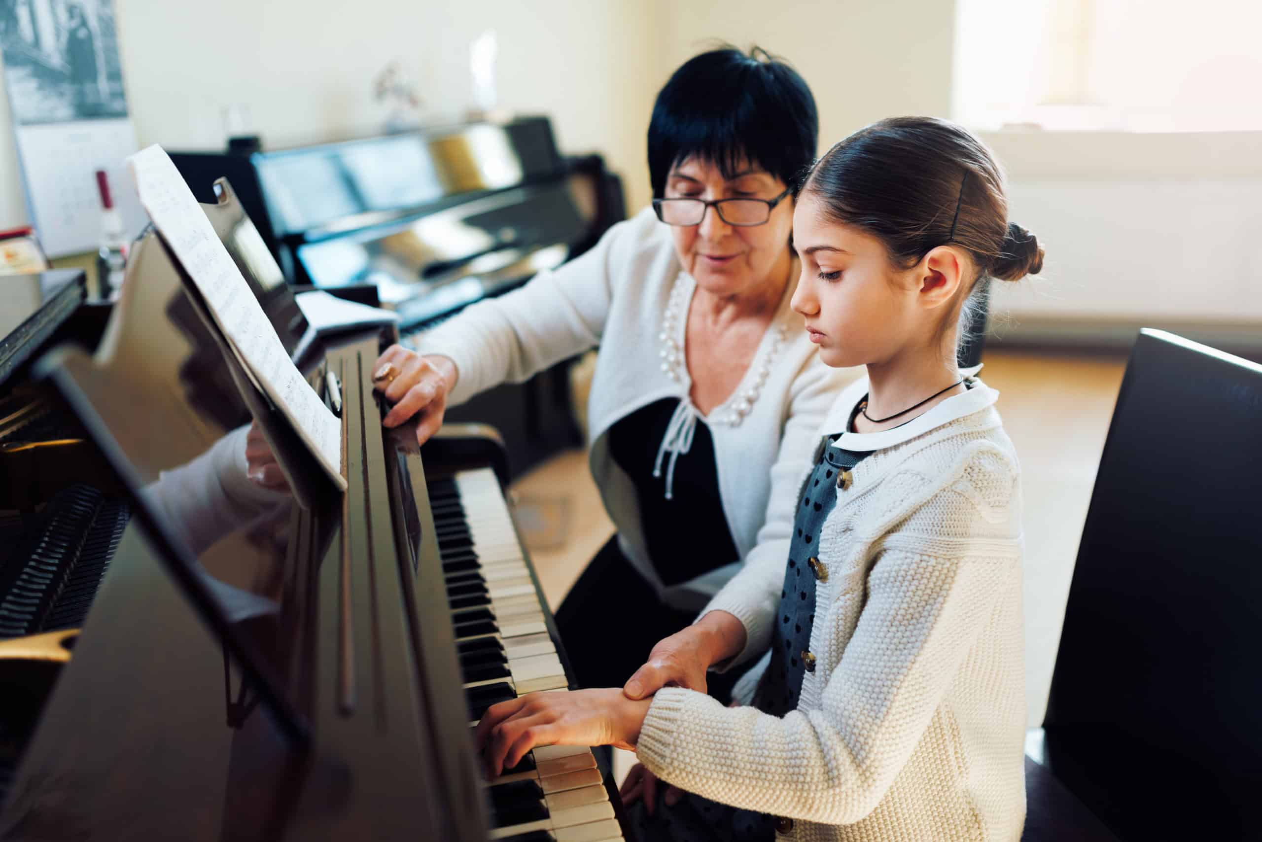 Featured image for The Ultimate Guide to Piano Lessons for Kids: Nurturing Young Pianists with Volz Piano